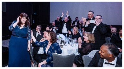 Kate Clawson (in blue dress, left), following the announcement of her win of Factory Manager of the Year at 2024's award, will join the judging panel for 2025